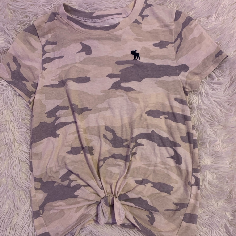 A camo shirt with a tie